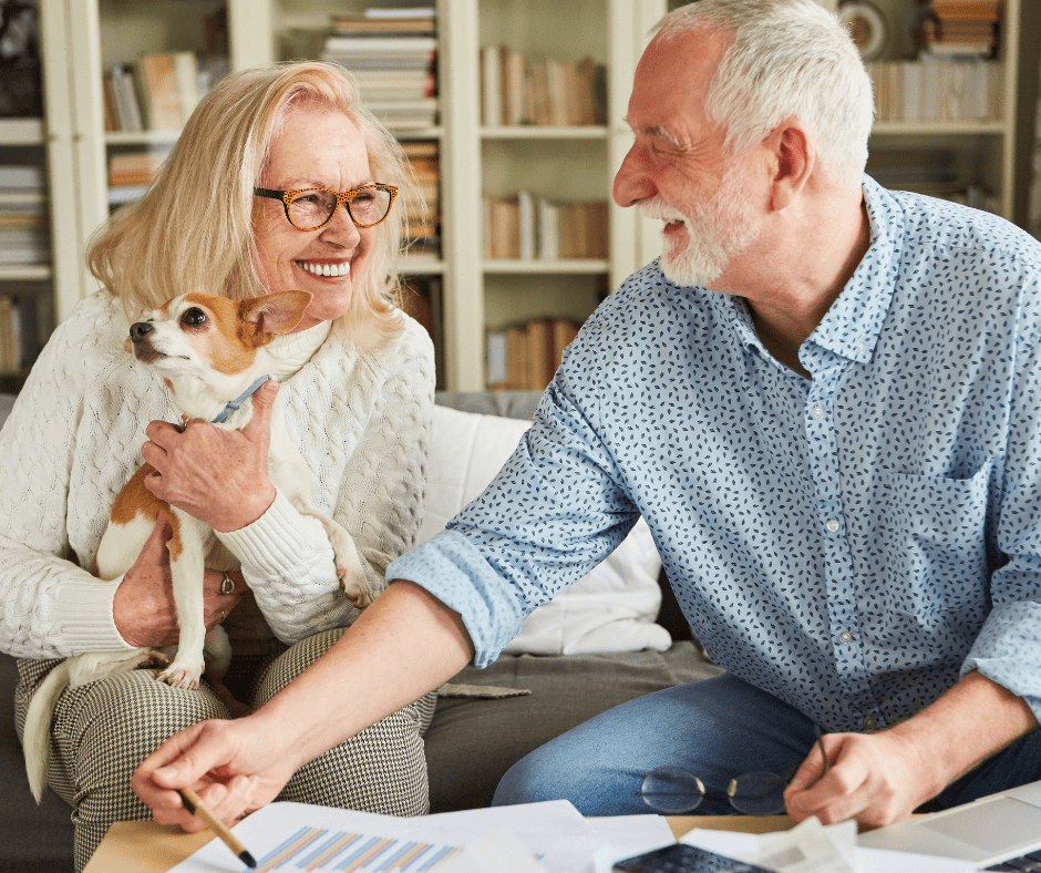 April 25 Events Page Image - The Landon at Lake Highlands Elderly man and woman smiling and holding small dog