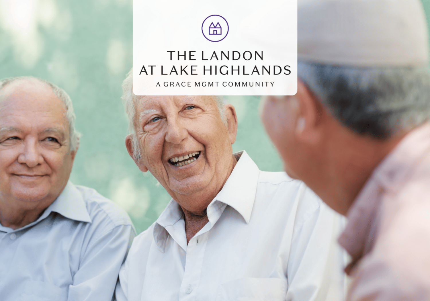 Three smiling older men sit outdoors, with a white sign showing 'The Landon at Lake Highlands, A Grace Mgmt Community' over them.