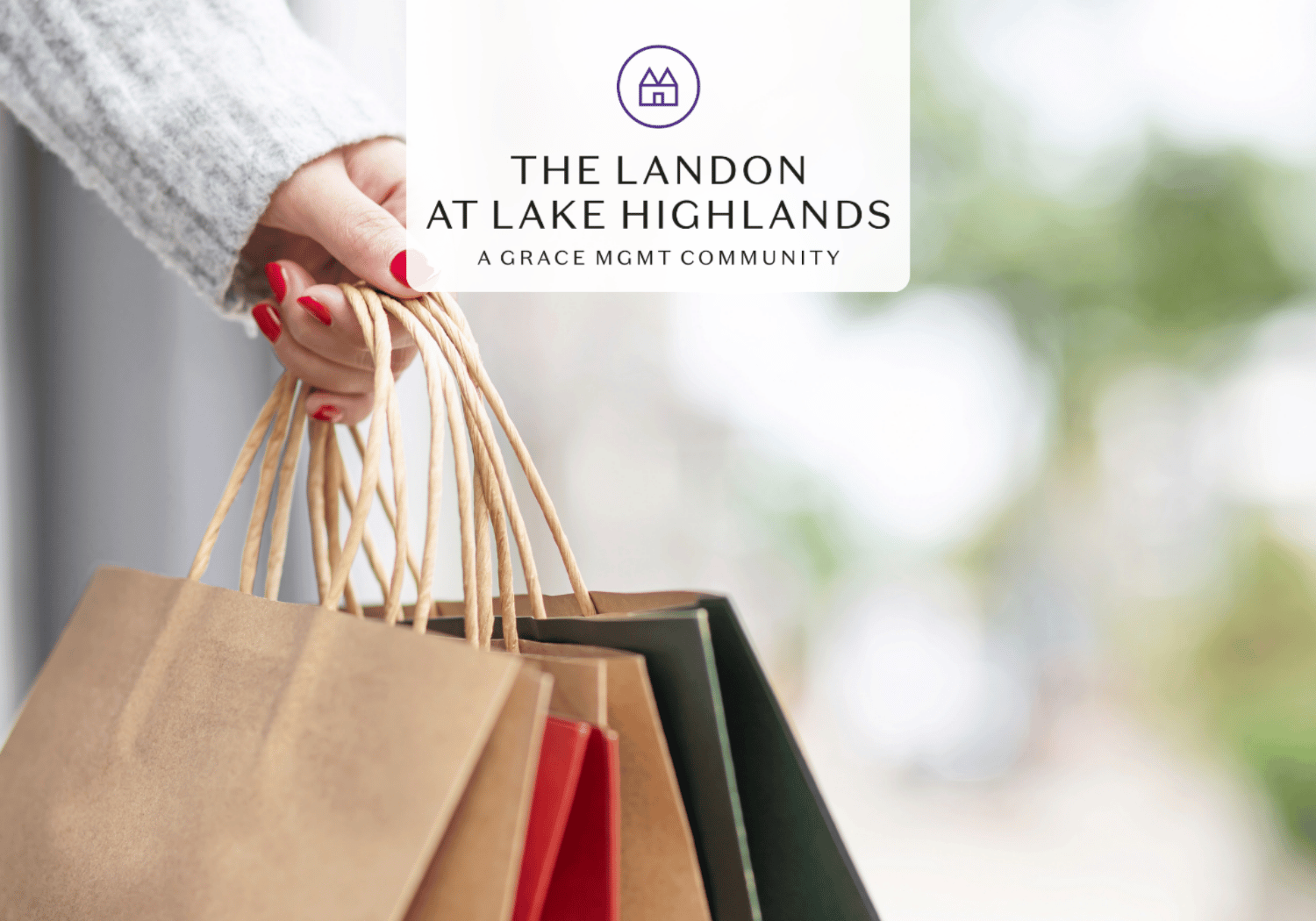 Hand holding multiple brown shopping bags with red nails; logo and name 'The Landon at Lake Highlands' overlaid.